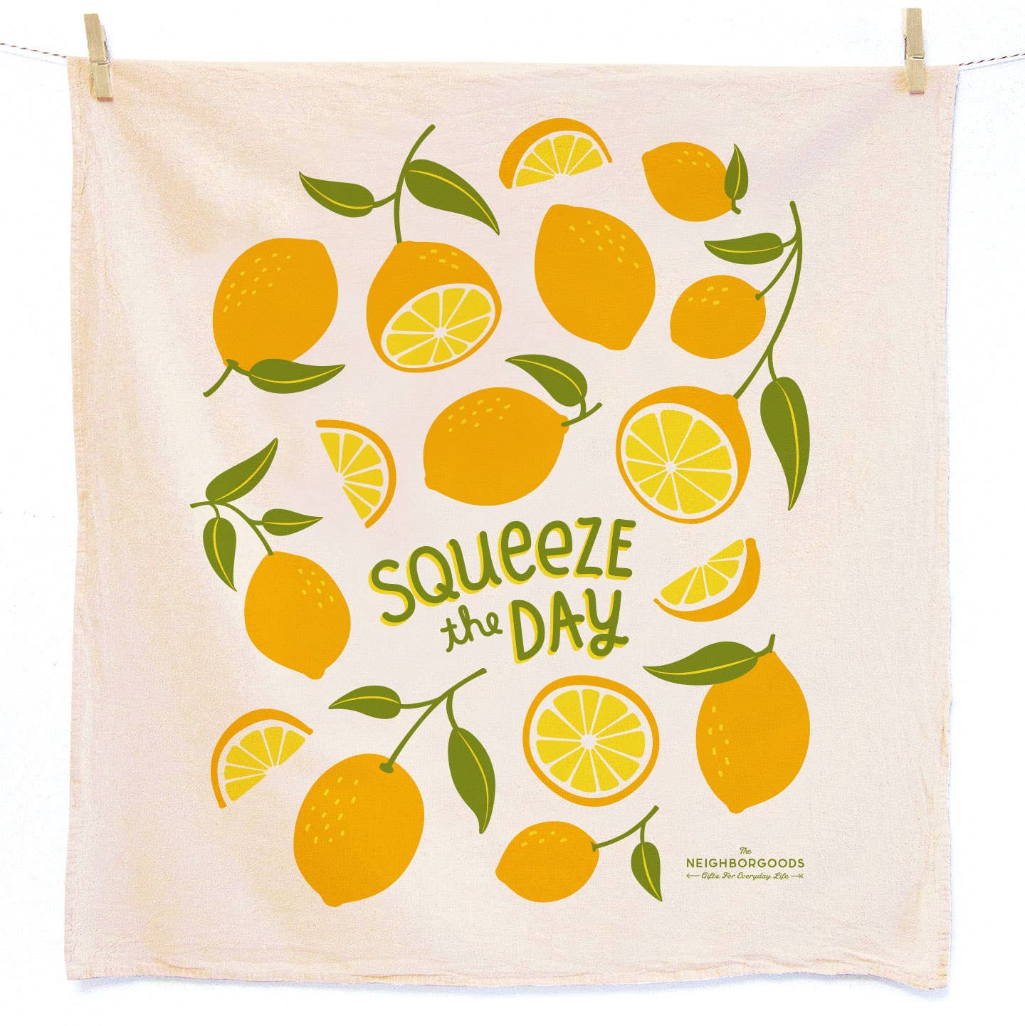 Towel with lemon design and 'Squeeze the Day' text, hanging on a line.