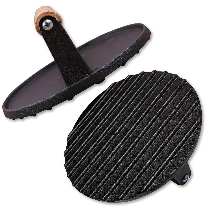 Two black rubber pads with textured surfaces on a white background
