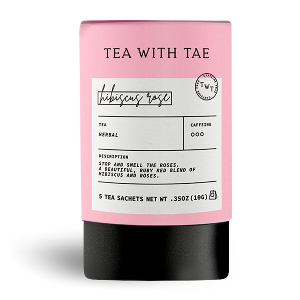 Pink packaging of 'Tea with Tae' with a label on a white background