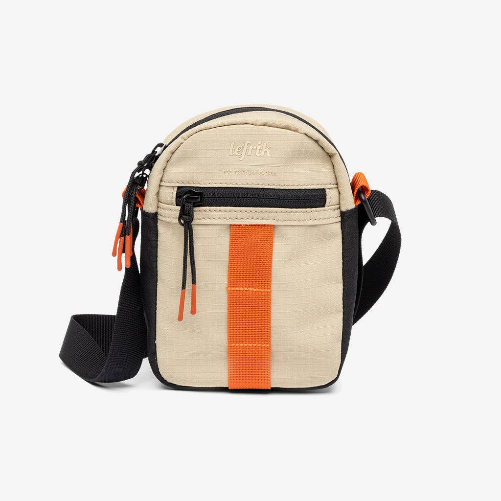 Beige crossbody bag with orange stripe and black strap on a white background