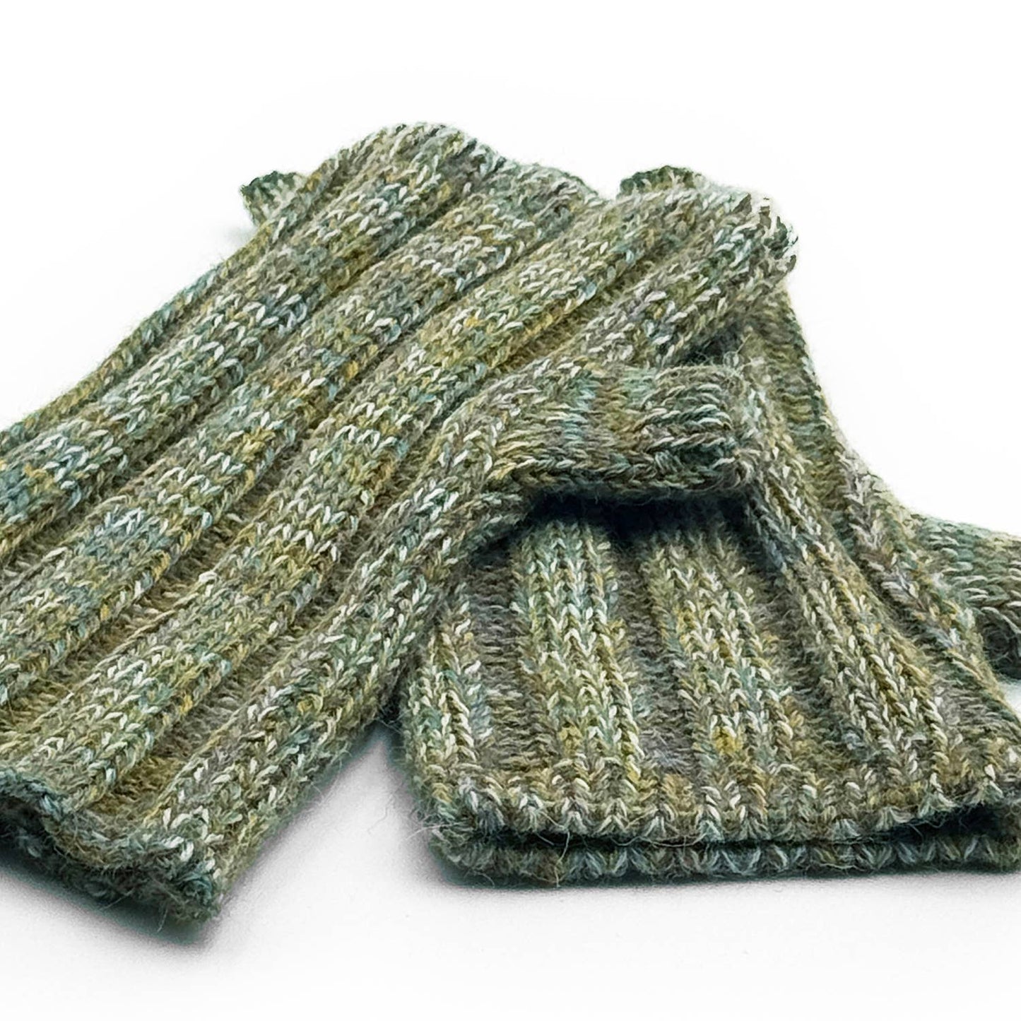 Pair of green knitted fingerless gloves on a white background
