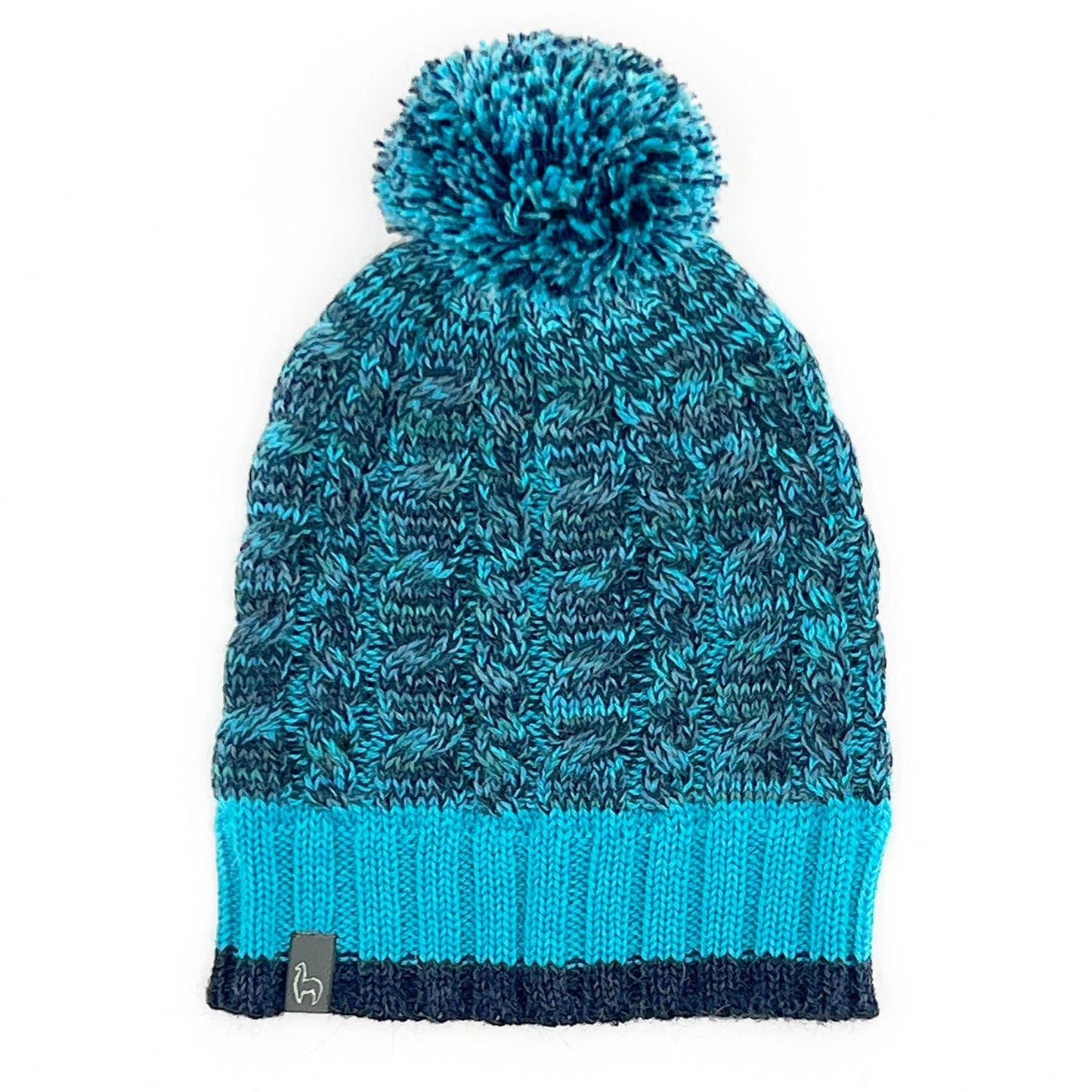 Blue knitted beanie with pom-pom on a white background