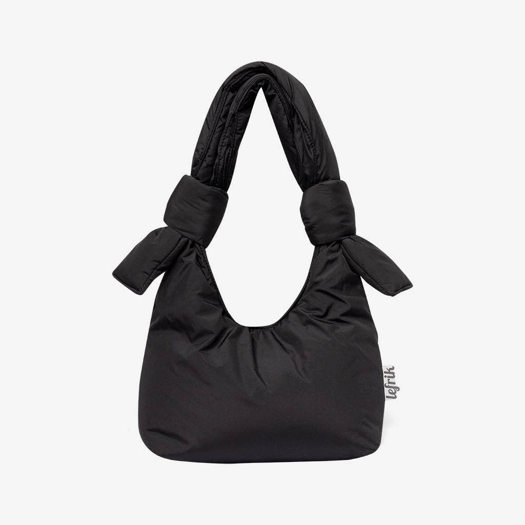 Black handbag with bow details on a white background