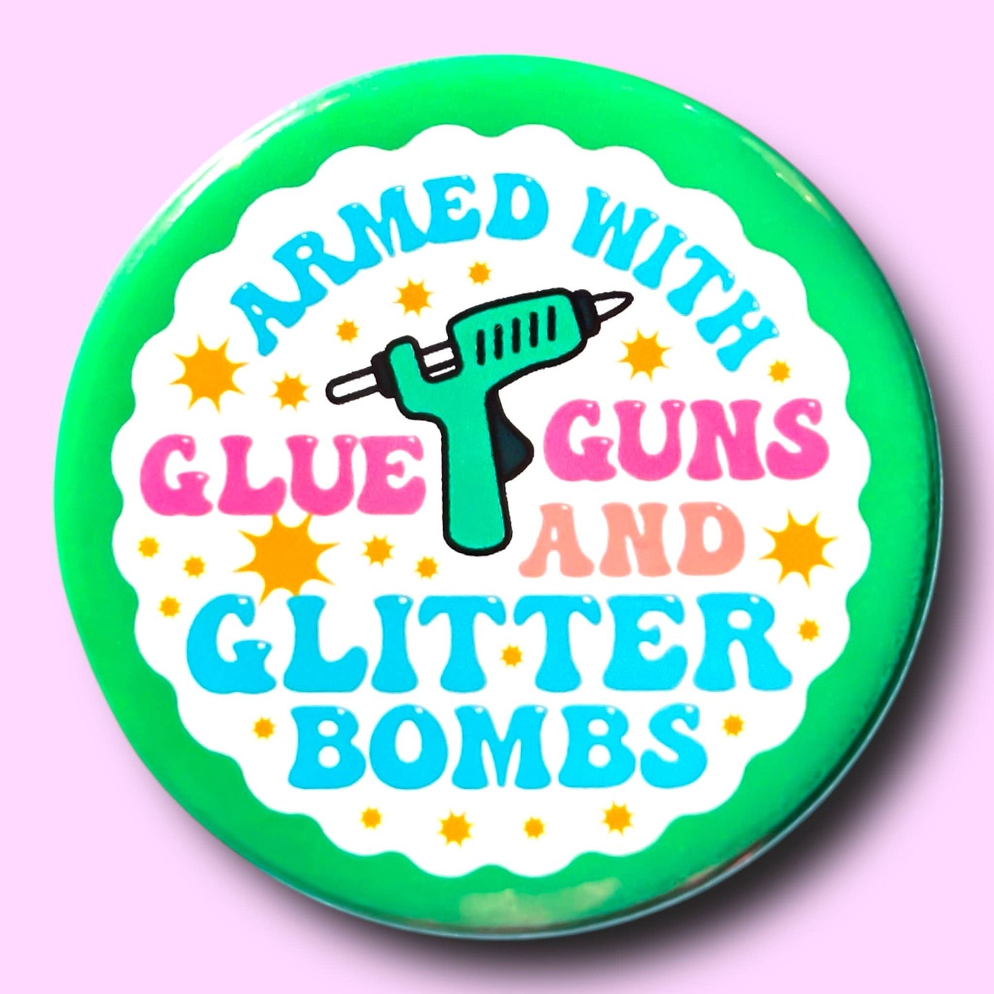 ARMED WITH GLUE GUNS AND GLITTER BOMBS pin