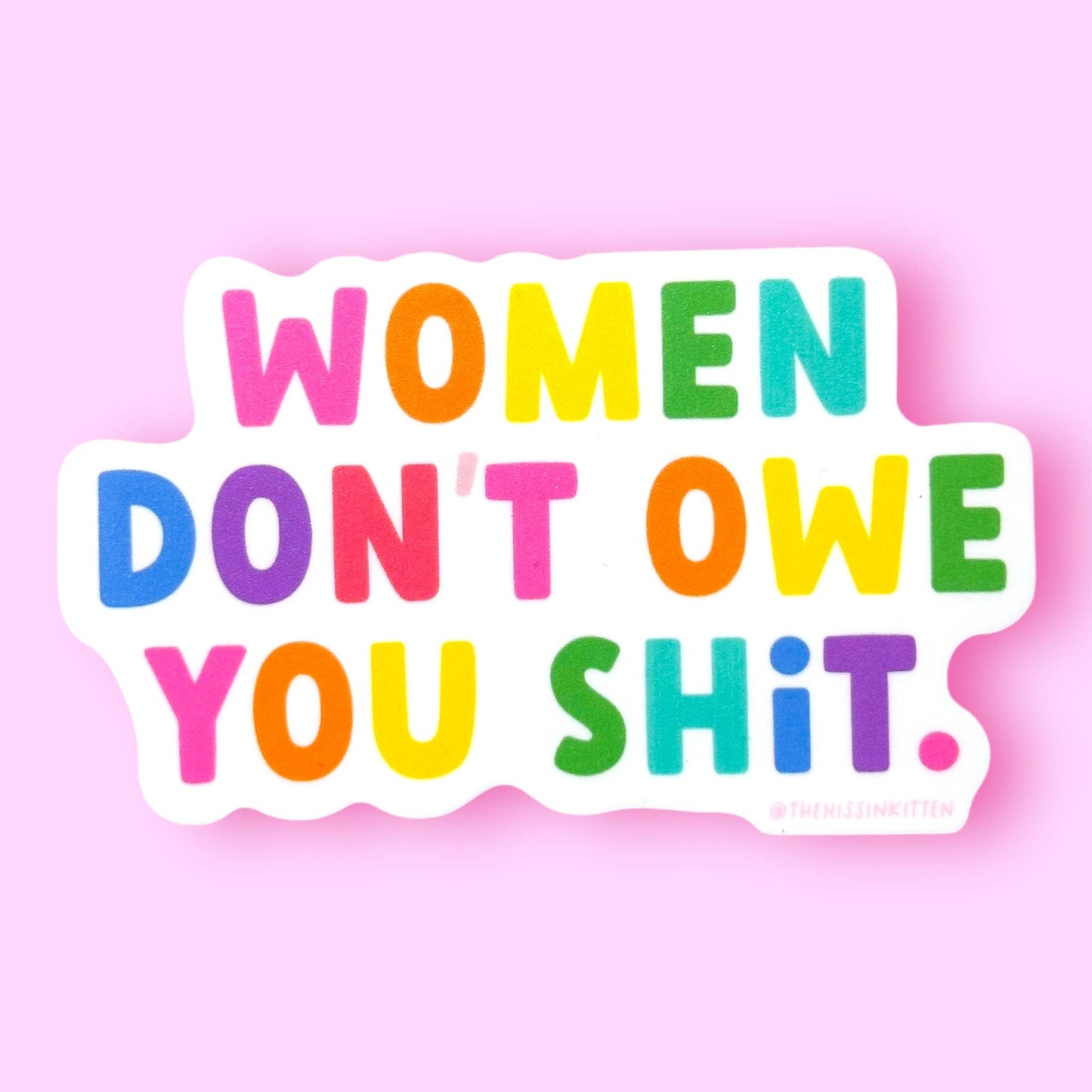 Colorful text 'WOMEN DON'T OWE YOU SHIT.' on a pink background