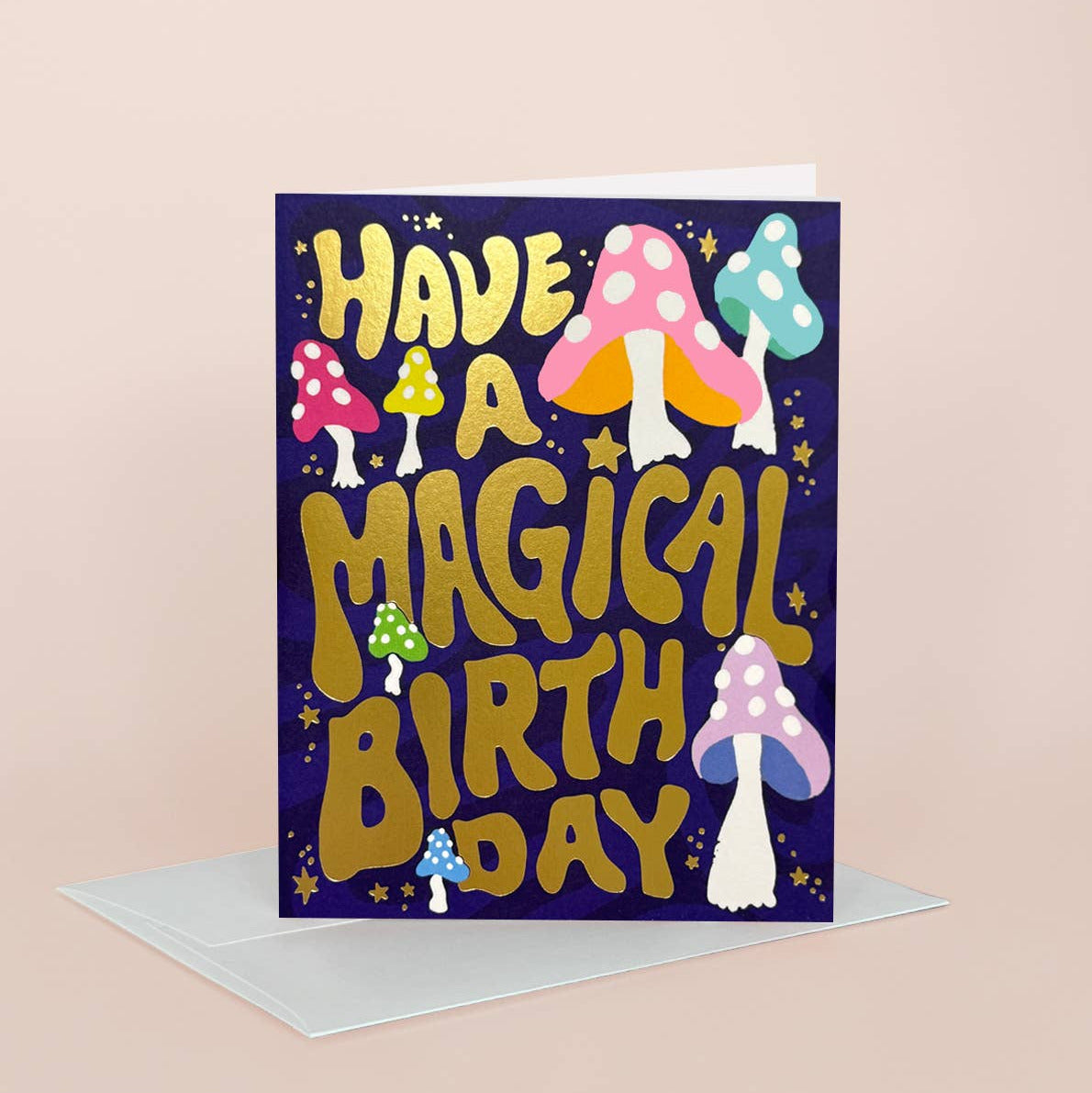 Greeting card with colorful mushrooms and 'Have a Magical Birthday' text on a purple background