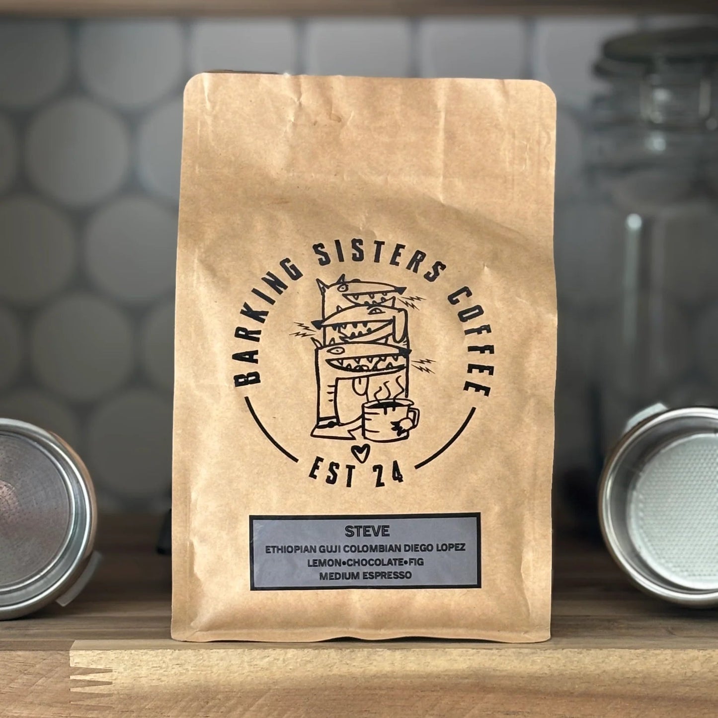 Barking Sisters Coffee package on a wooden shelf with a blurred background