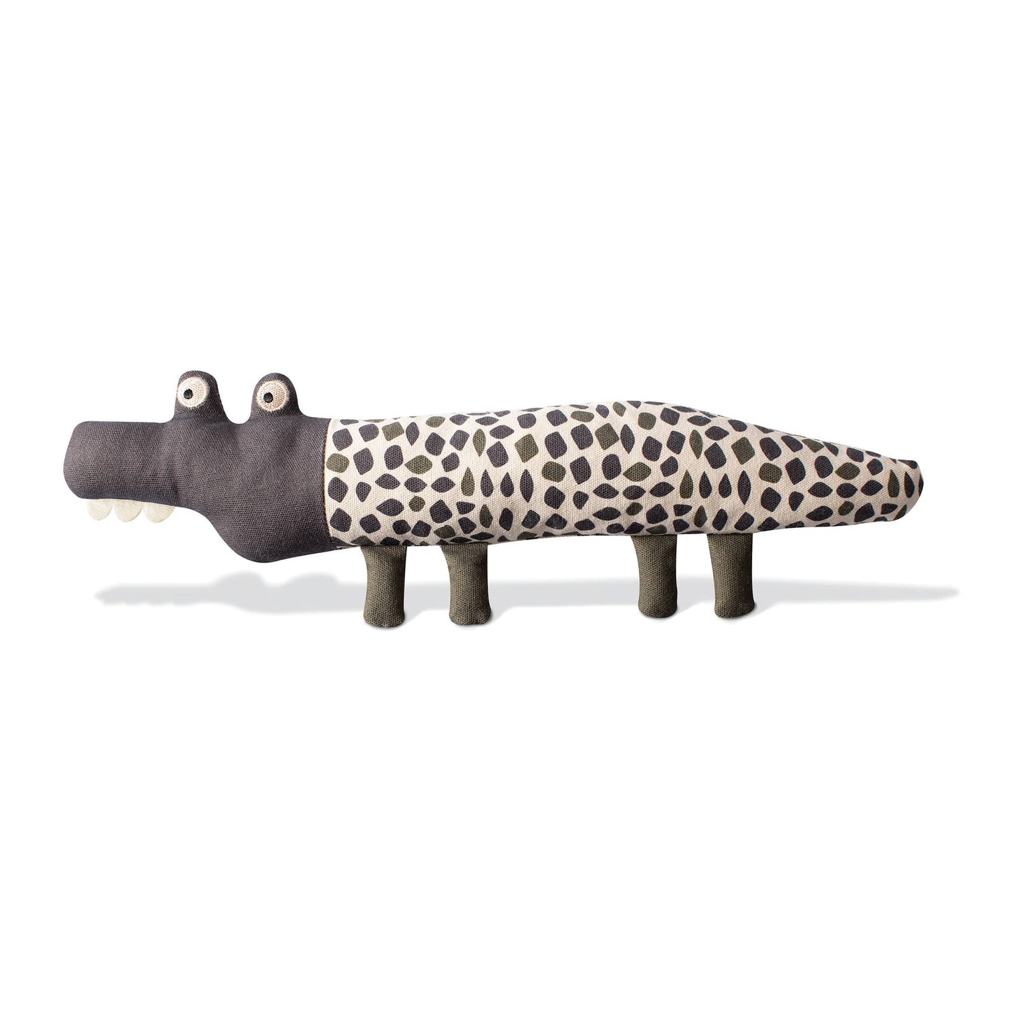 Toy alligator with a spotted pattern on a white background
