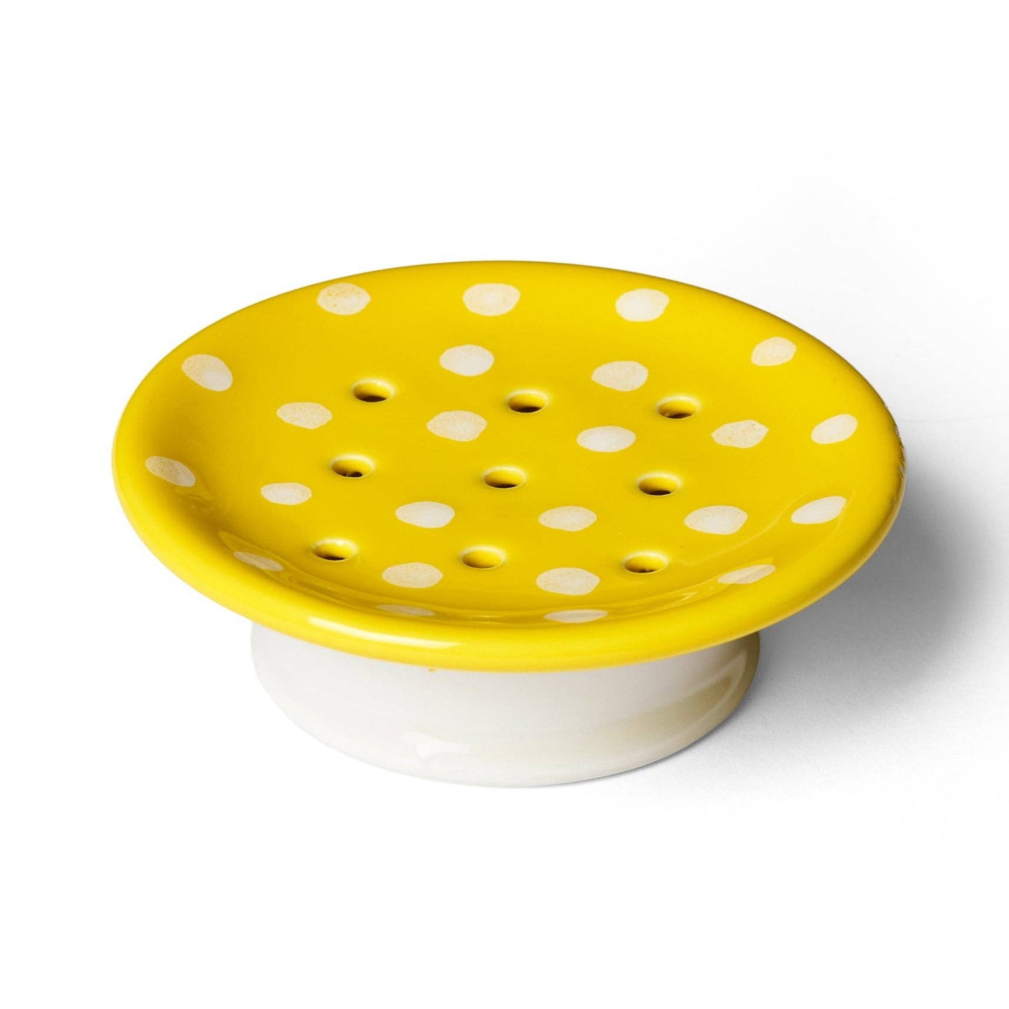 Yellow soap dish with white polka dots on a white background