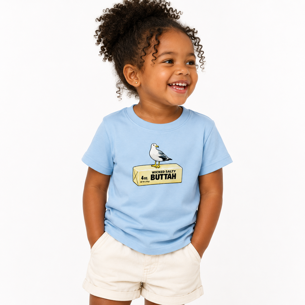 Child wearing a light blue t-shirt with a graphic design on a white background