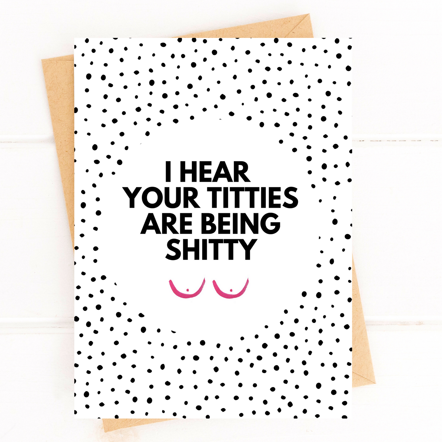 Card with polka dot pattern and humorous text on a white background