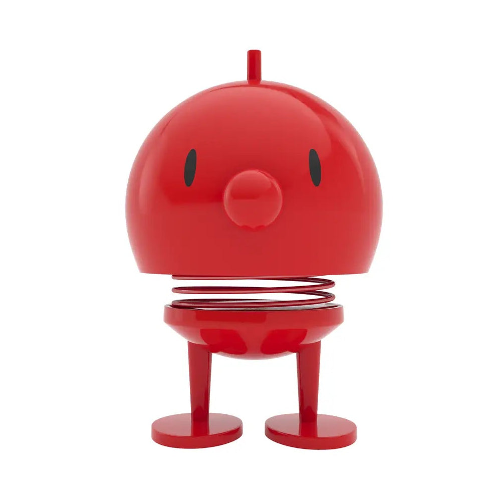 Red character-shaped object on a white background