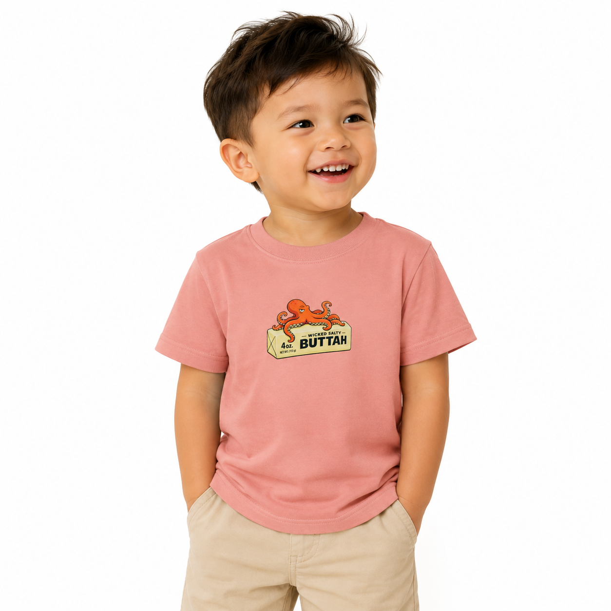 boy wearing a shirt with a silly octopus on top of a stick of butter