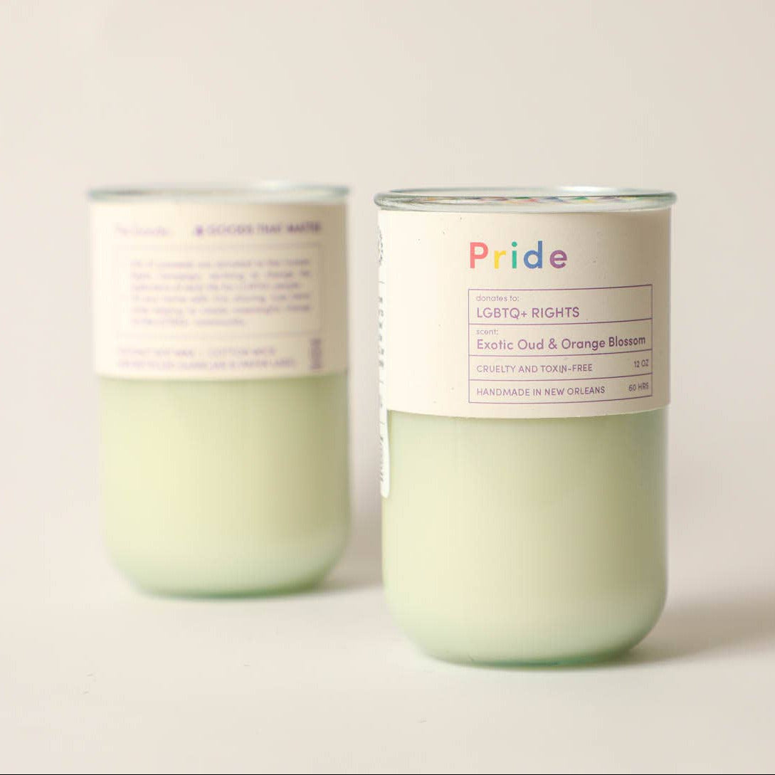 Two candles with labels on a light background
