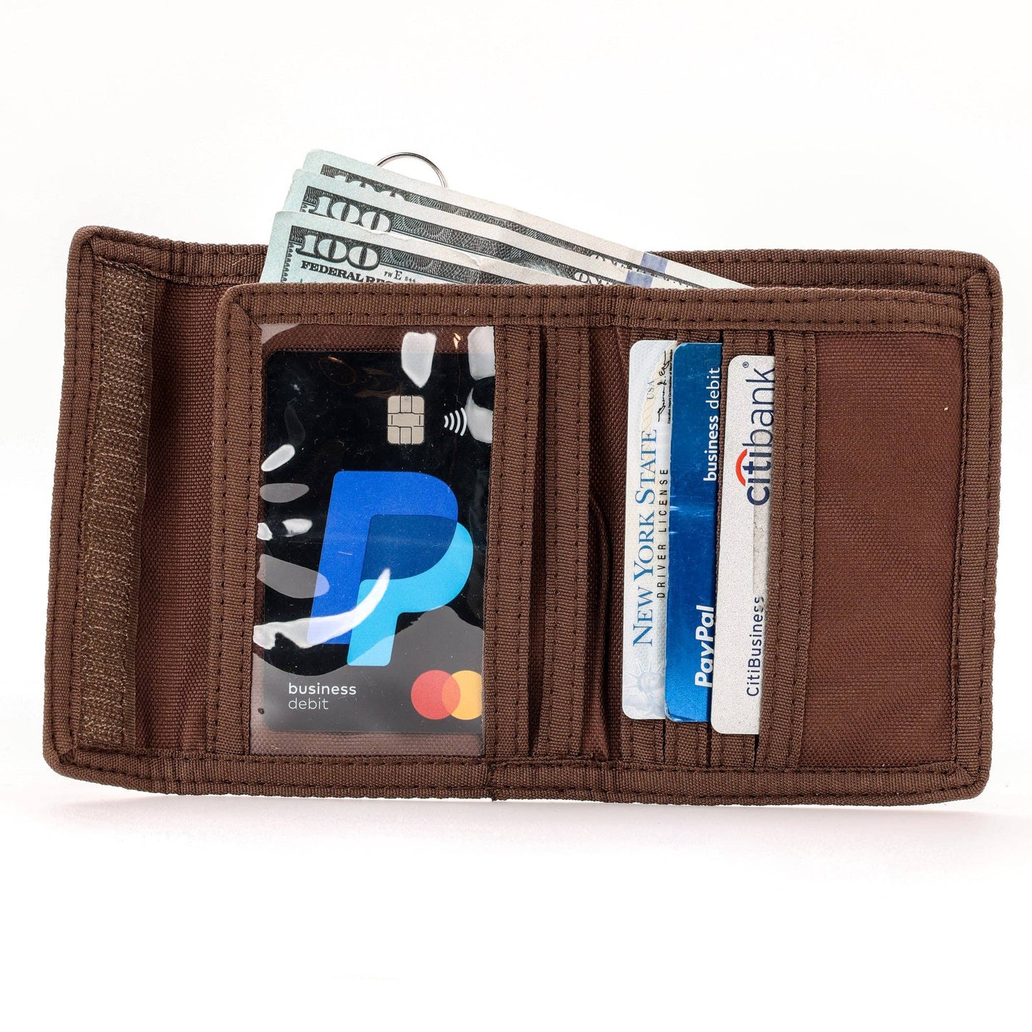 Brown wallet with cards and money on a white background