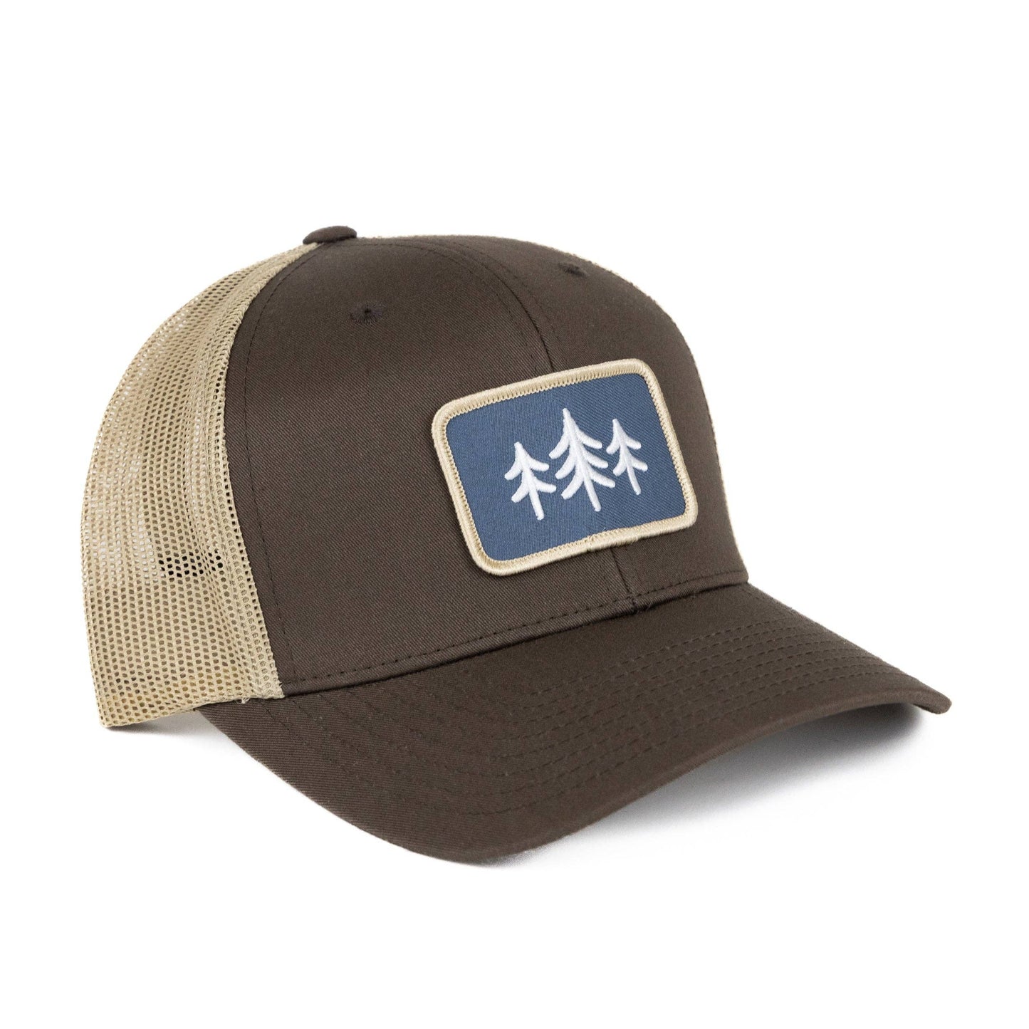 Brown and beige cap with a blue patch featuring white tree designs on a white background