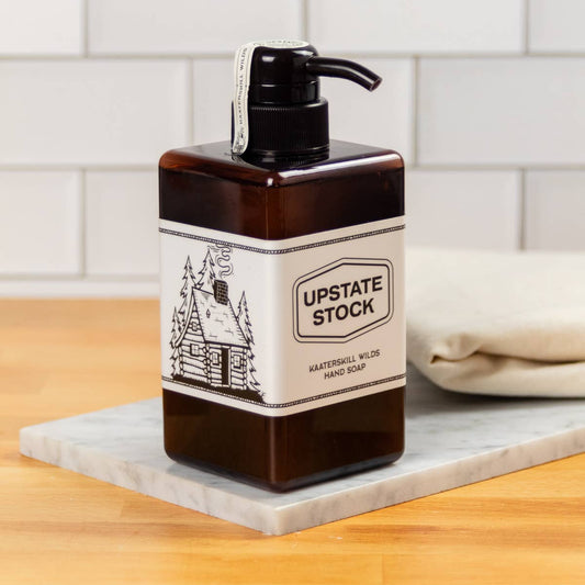 Hand soap bottle with 'Upstate Stock' label on a kitchen counter