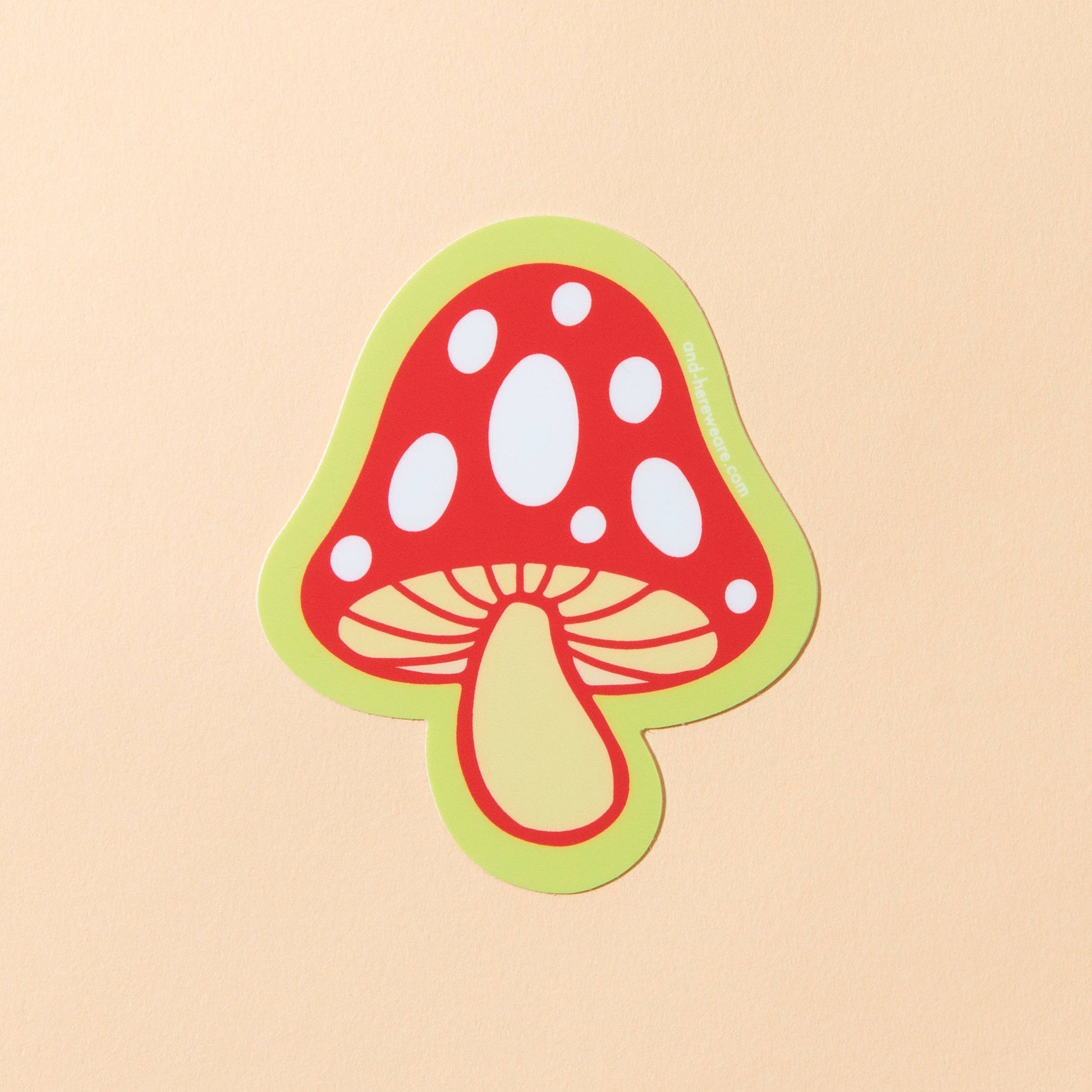 Illustration of a red mushroom with a green border on a beige background
