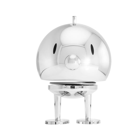 A polished chrome decorative bird figurine with a rounded body, small beak, and three legs, centered on a plain white background.