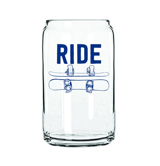 Clear glass tumbler with blue 'RIDE' and skateboard graphics on a white background