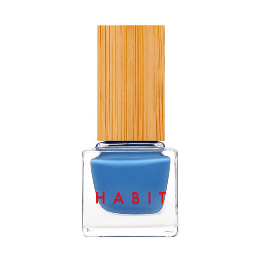 Blue nail polish bottle with a wooden cap on a white background