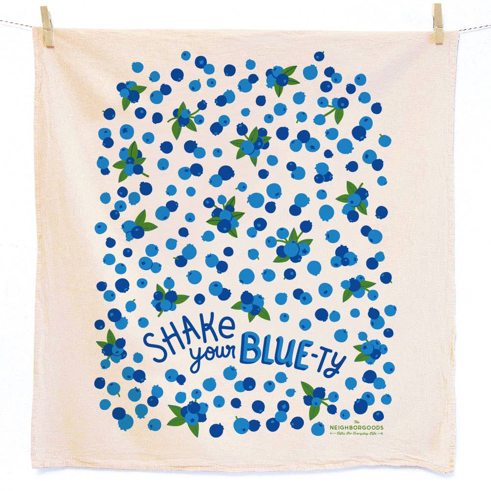 Towel with blueberry pattern and text 'Shake your BLUE-ty' on a white background