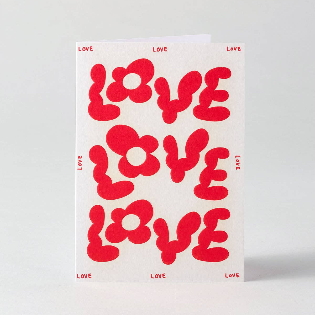 Card with red 'LOVE' text on a white background