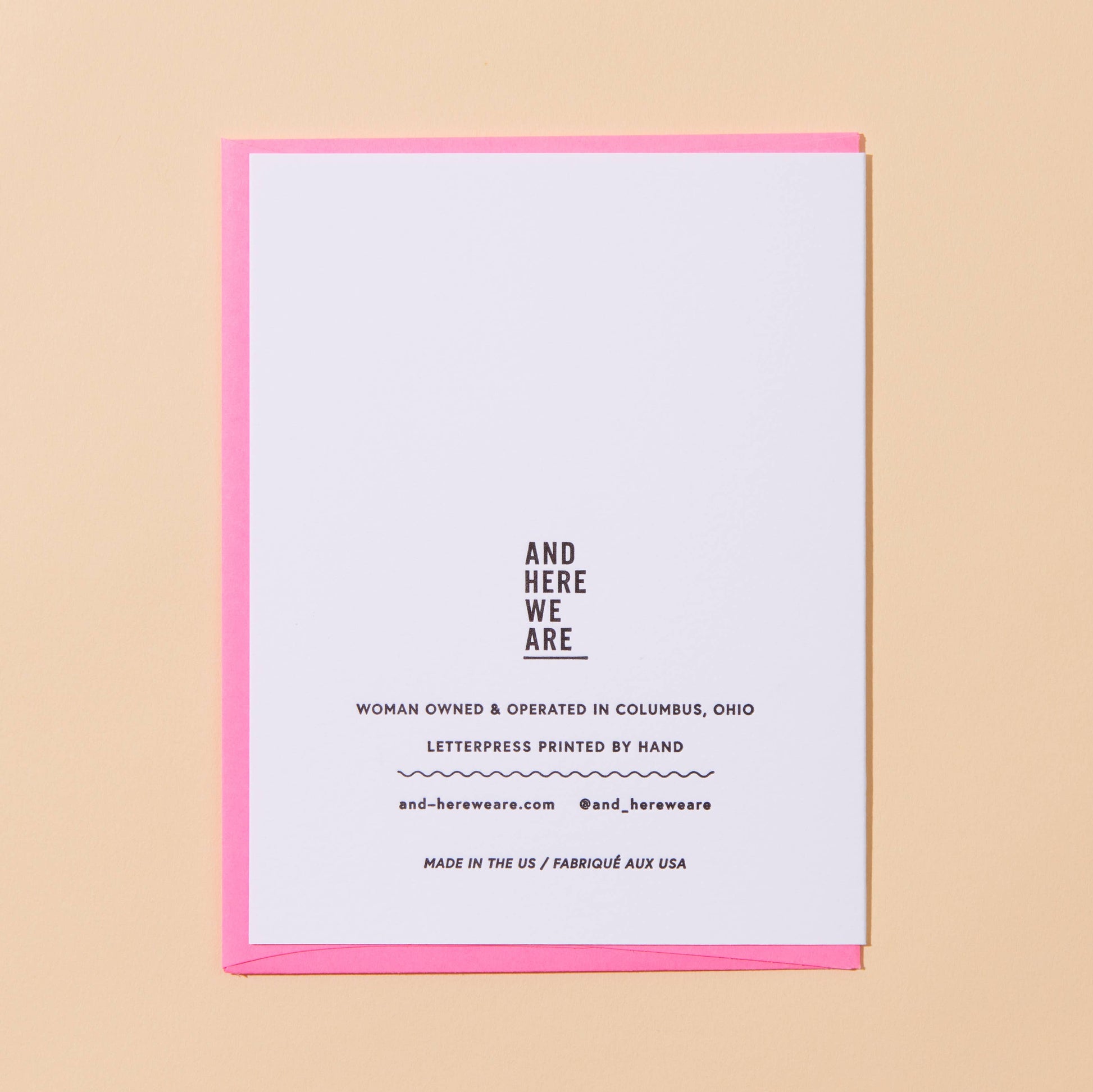 White card with black text on a beige background