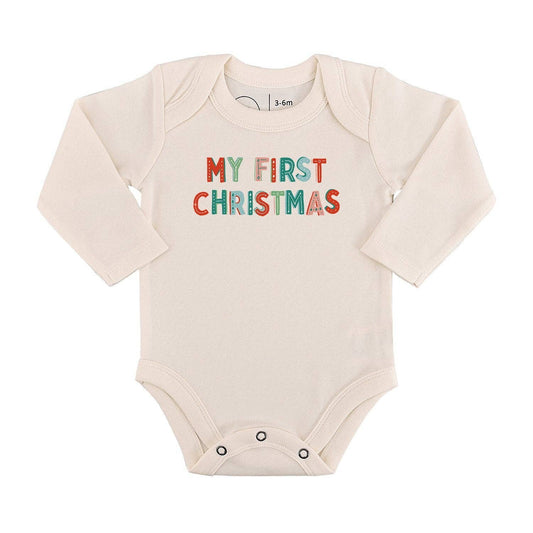 Baby onesie with 'My First Christmas' text on a white background