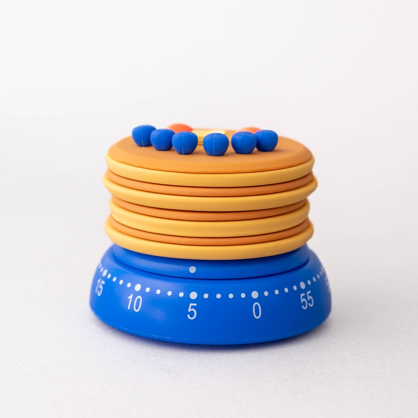 Colorful kitchen timer with blue and orange bands on a white background