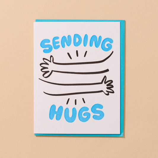 Card with 'Sending Hugs' text and hug illustrations on a beige background