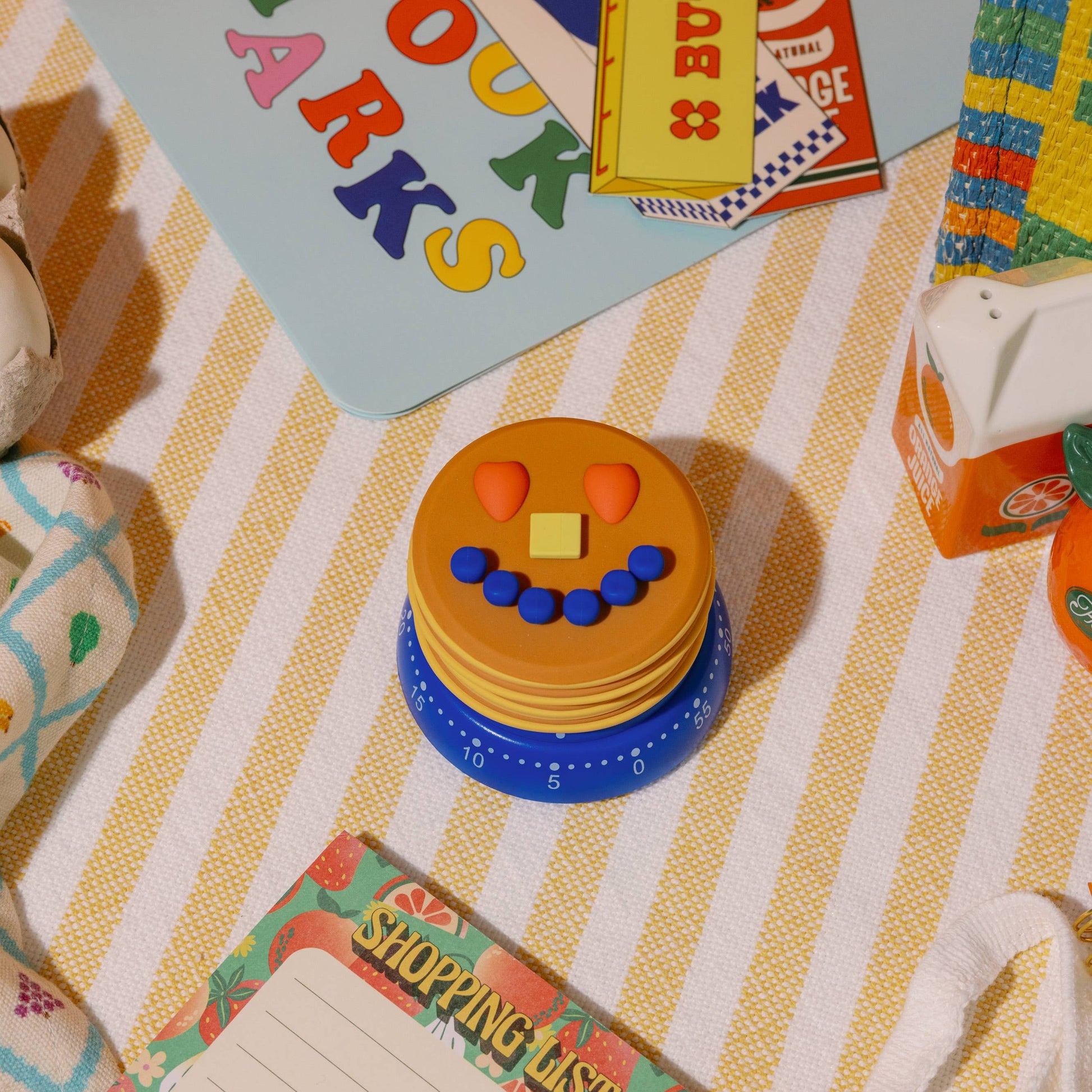 Colorful children's play items on a striped surface