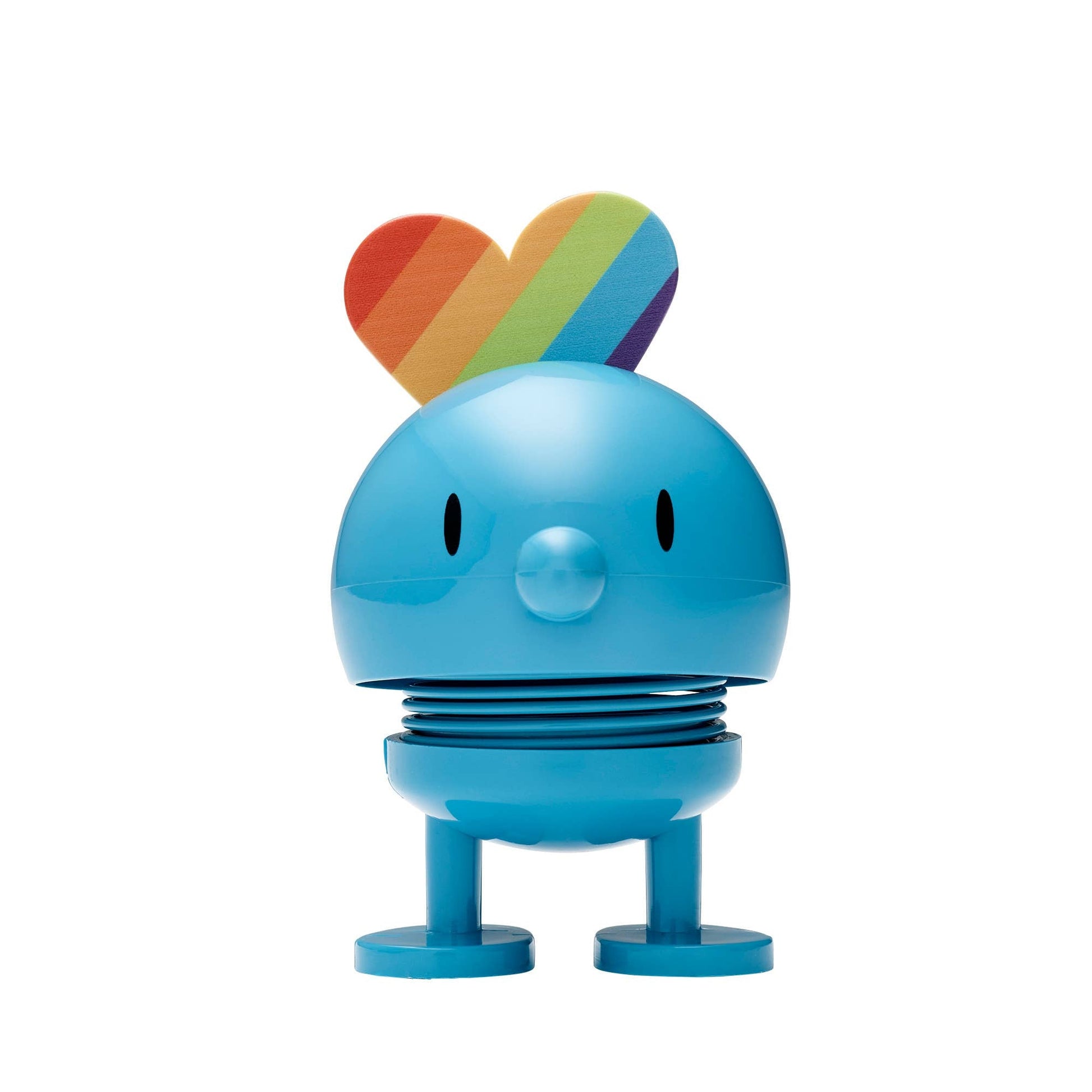Blue cartoon-like character with a rainbow heart on a white background