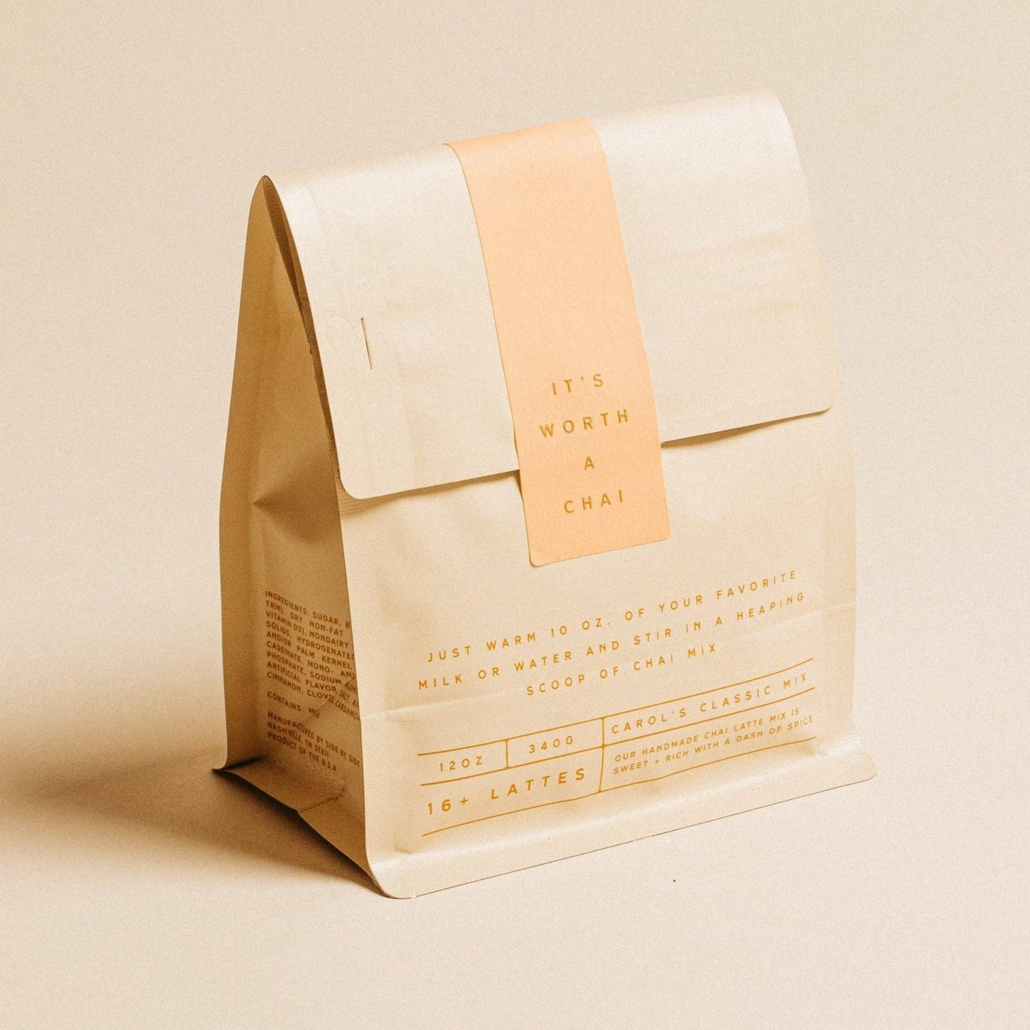 Beige coffee bag with a brown leather tag on a beige background
