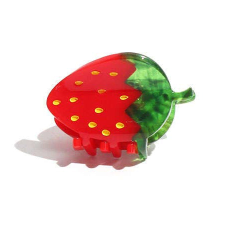 Strawberry-shaped hair clip on a white background