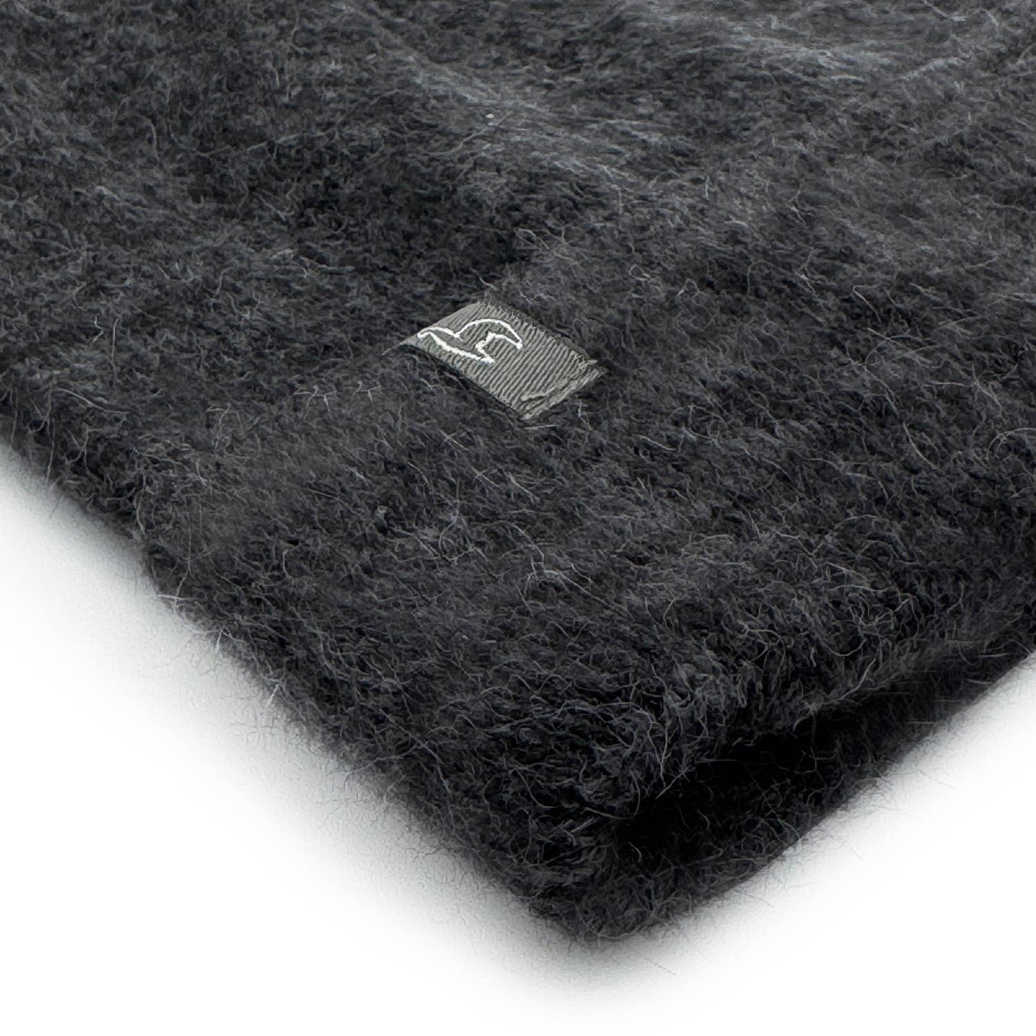 Dark gray knit fabric with a brand logo on a white background