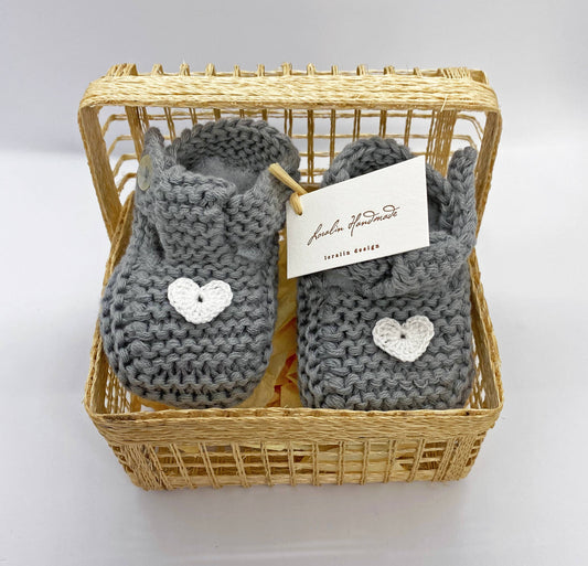 Grey booties with hearts in basket