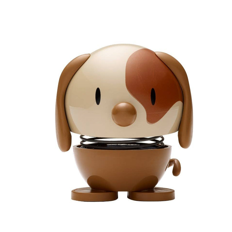 Small dog-shaped figurine on a white background