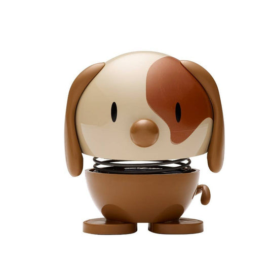 Small dog-shaped figurine on a white background