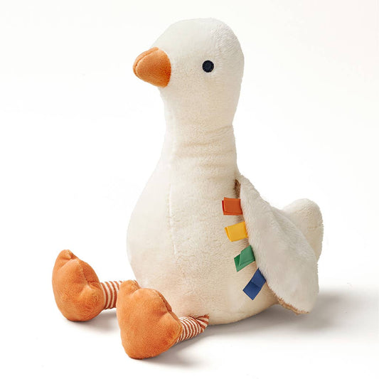 Plush toy goose with colorful accents on a white background