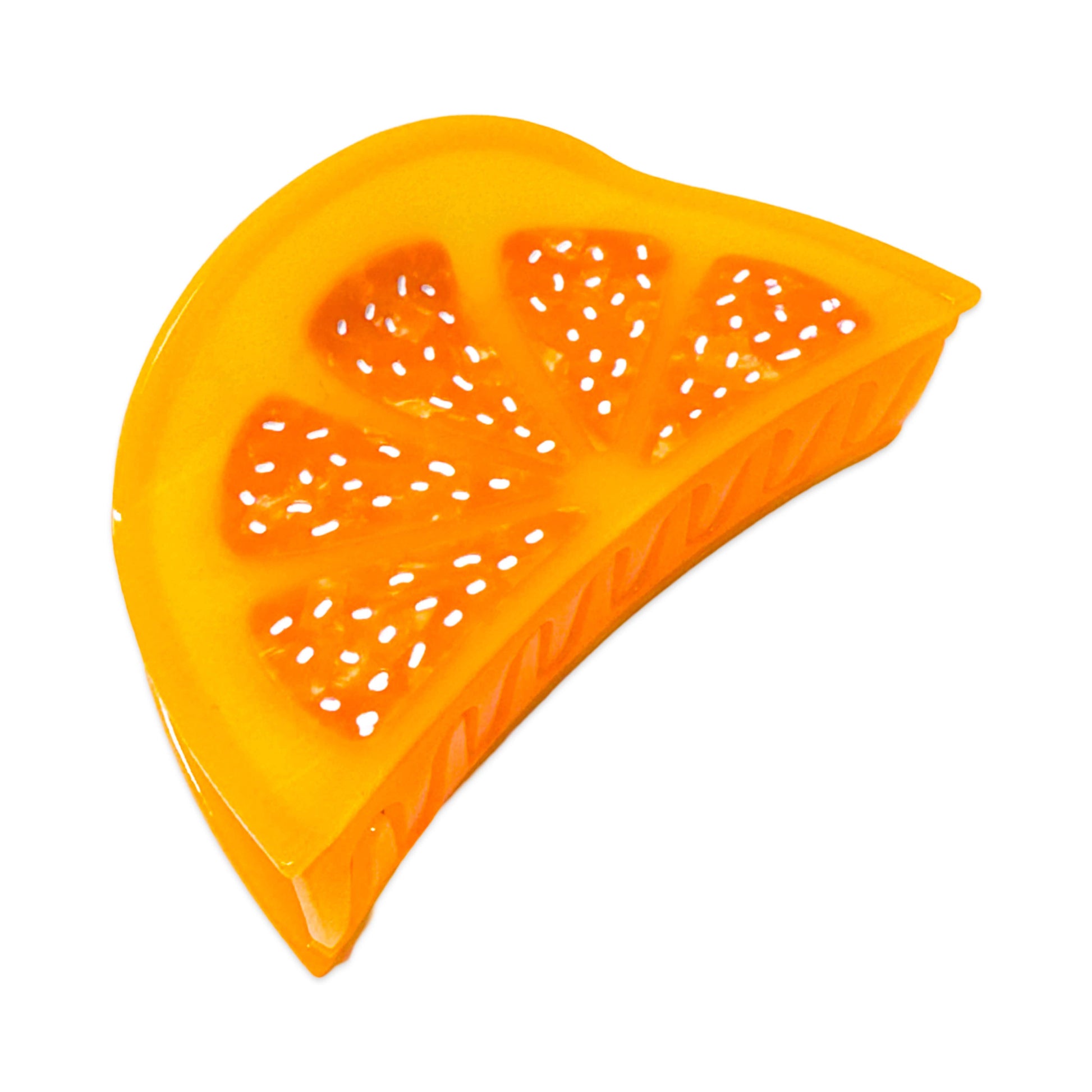 Orange plastic fruit slice with holes on a white background