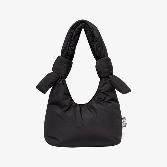 Black handbag with bow details on a white background