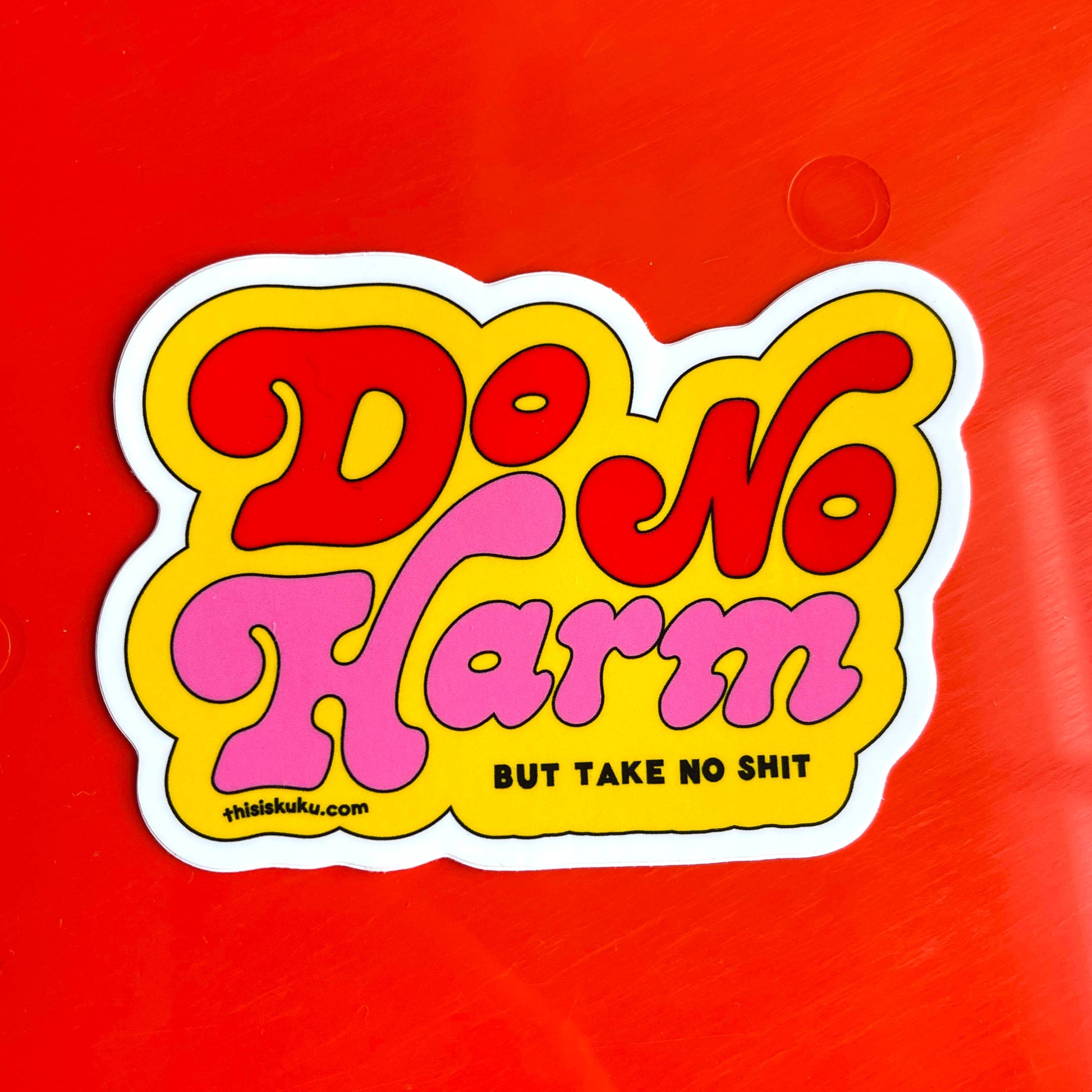 Sticker with 'Do No Harm, But Take No Shit' text on a red background