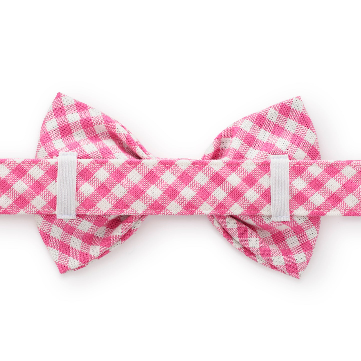 Pink and white checkered bow tie on a white background