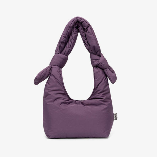 Purple handbag with knotted handle on a white background