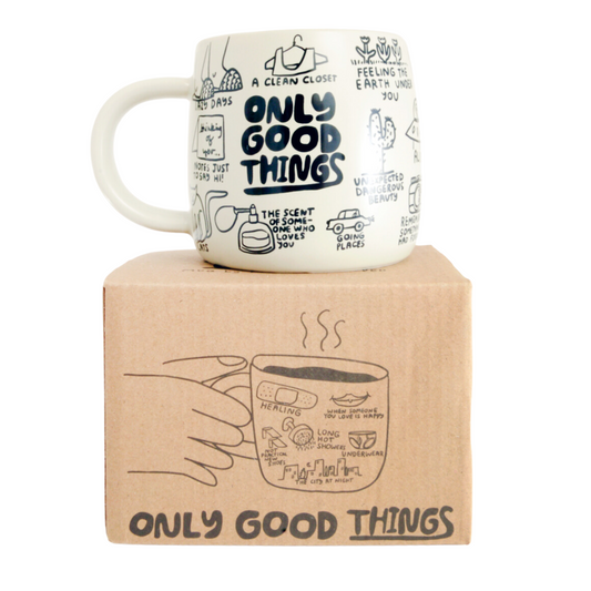 Mug with 'Only Good Things' text on a cardboard box
