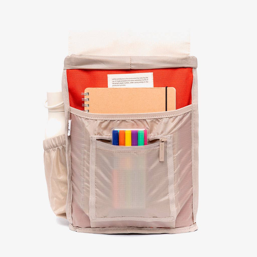 A beige nylon backpack organizer pouch shown open, filled with notebooks, a water bottle, and colorful pens, against a clean white background.