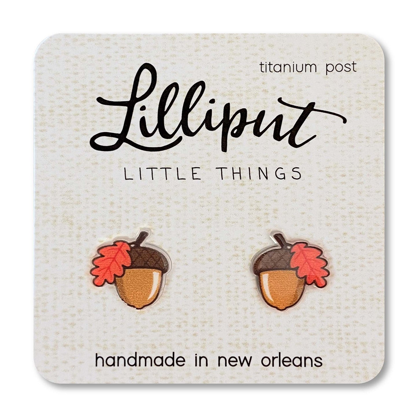 Acorn-shaped earrings on a Lilliput Little Things branded card.