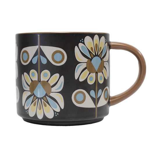 Black mug with floral pattern on a white background