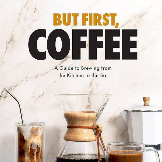 Book cover of 'But First, Coffee' with coffee-making equipment and drinks on a marble countertop.